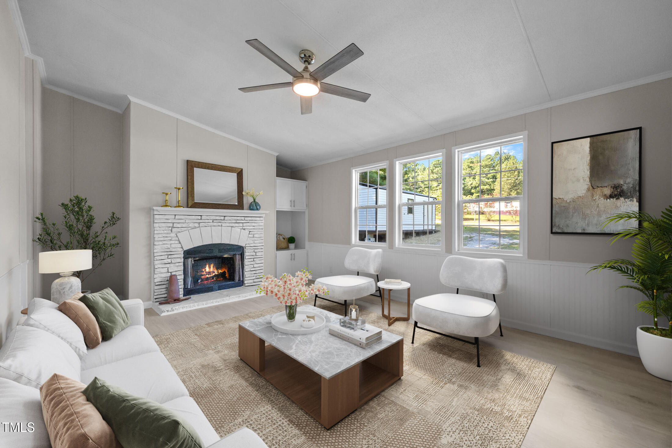 261 Ragland Lane Henderson, NC 27537 - Photo 4 of 58 a living room with furniture a fireplace and a potted plant