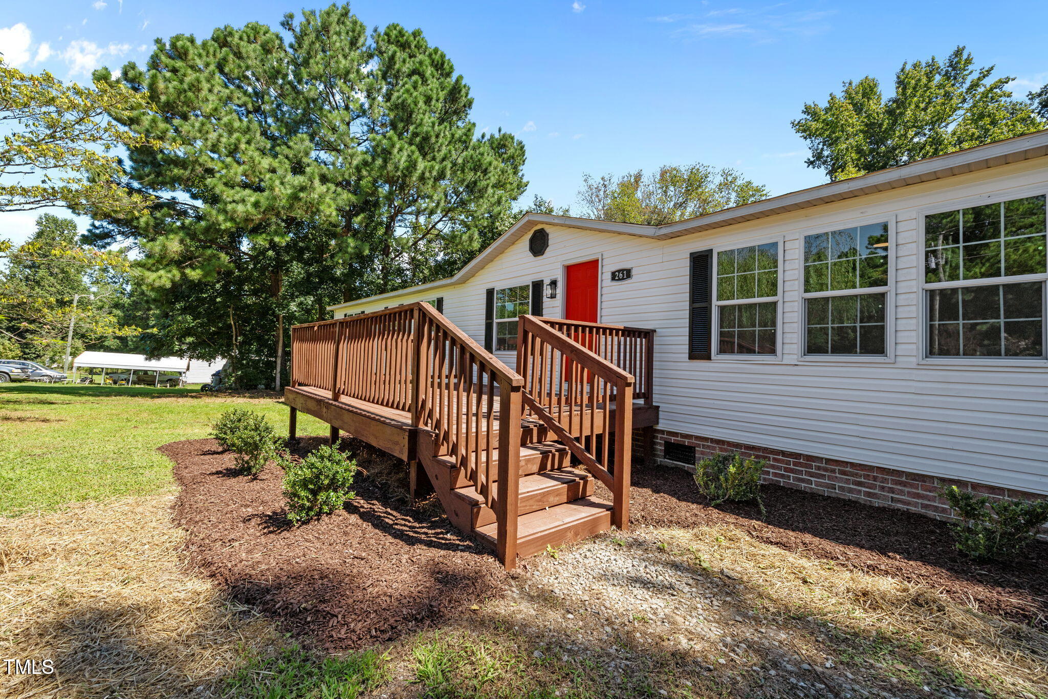 261 Ragland Lane Henderson, NC 27537 - Photo 50 of 58 a view of a house with a yard