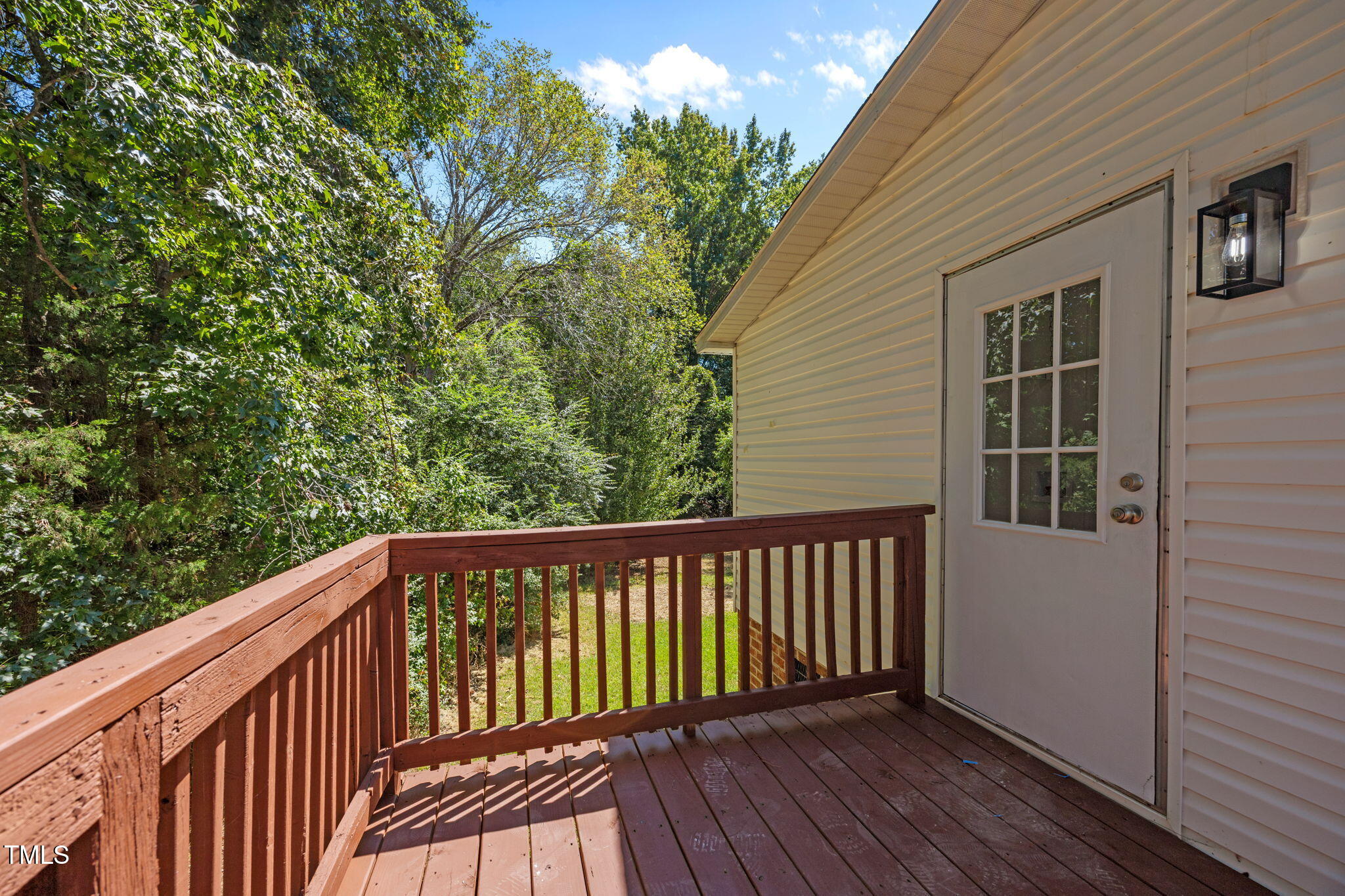 261 Ragland Lane Henderson, NC 27537 - Photo 51 of 58 a balcony with wooden floor and fence