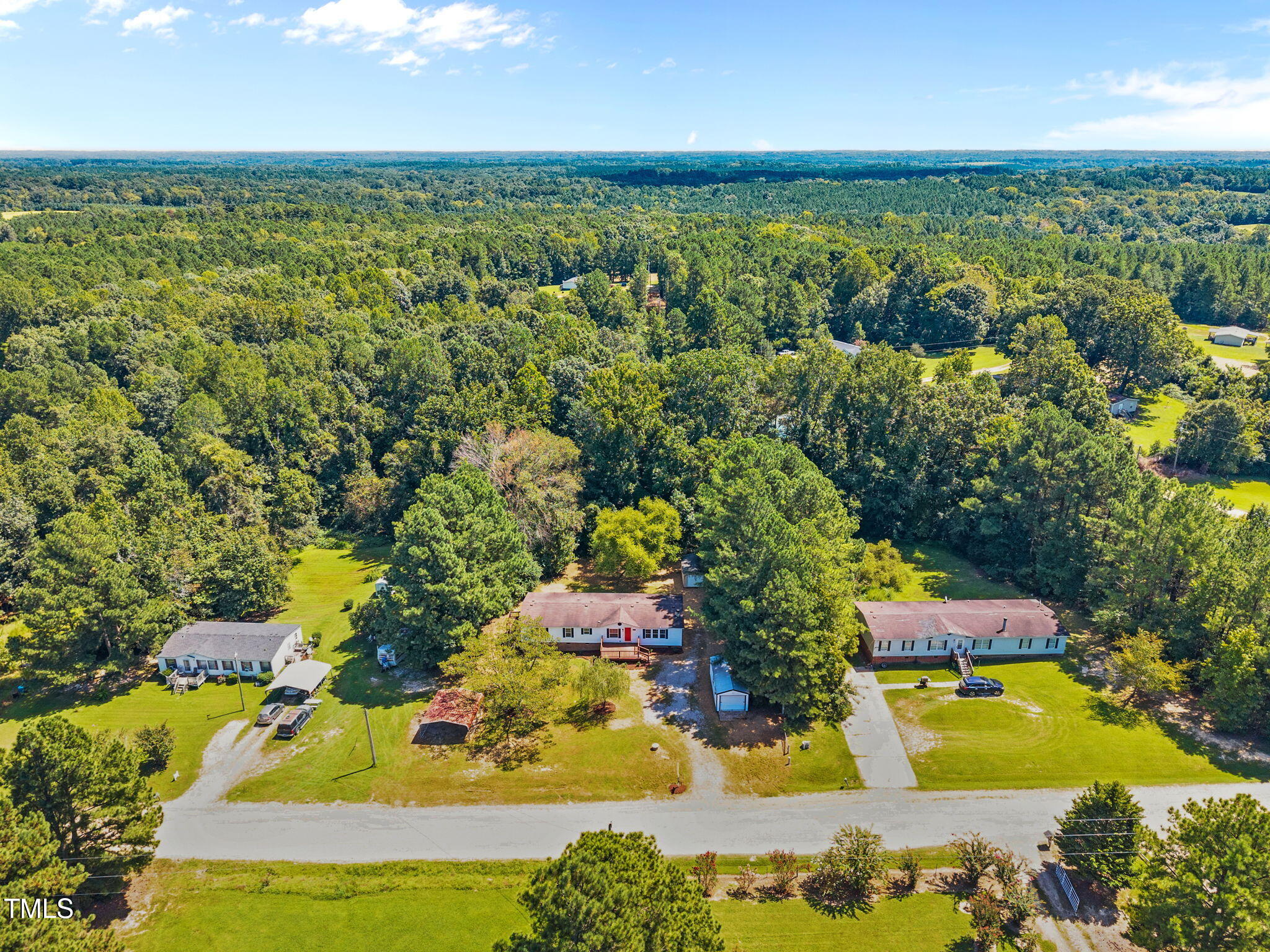 261 Ragland Lane Henderson, NC 27537 - Photo 55 of 58 an aerial view of residential houses with outdoor space and swimming pool