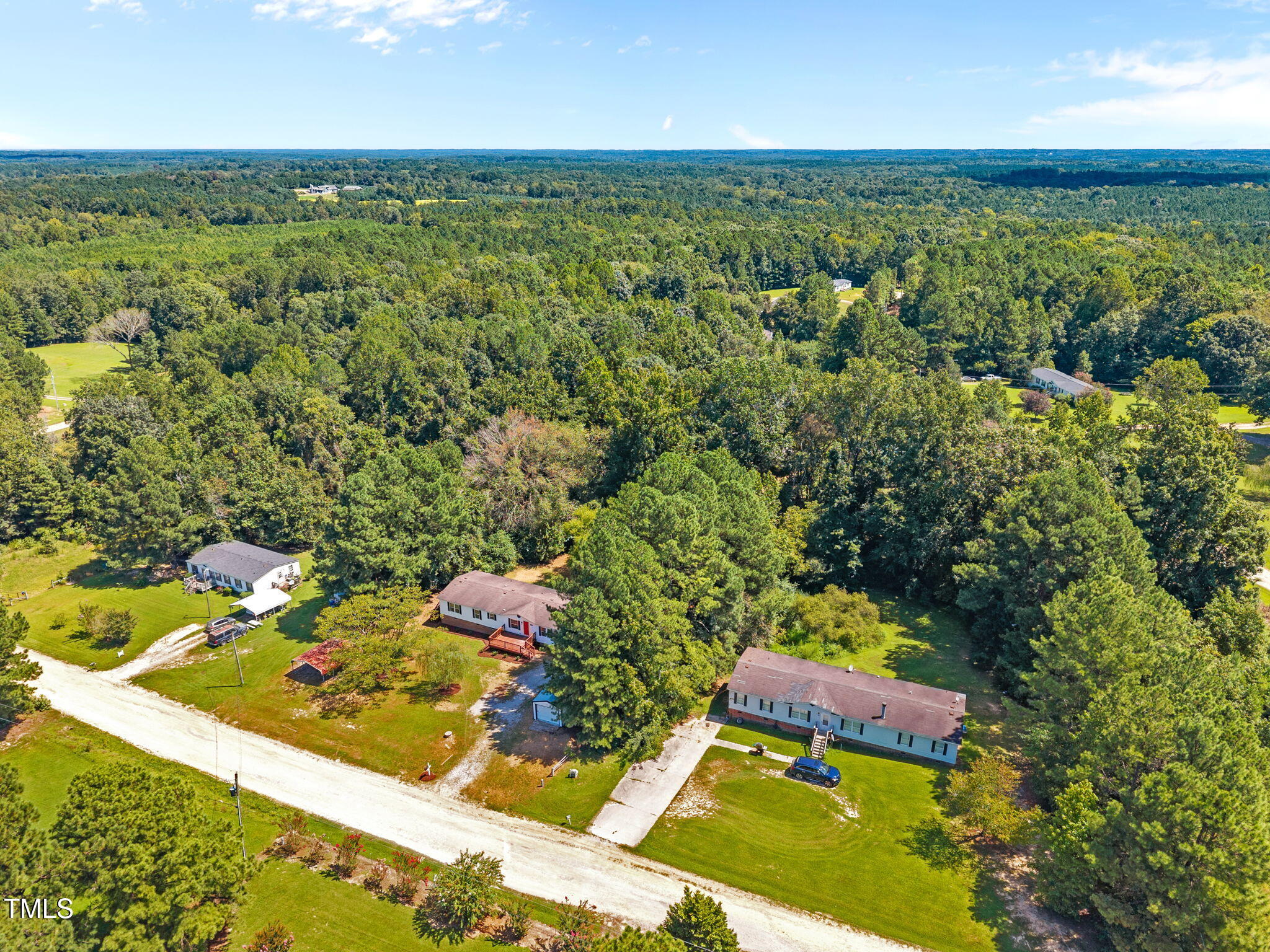 261 Ragland Lane Henderson, NC 27537 - Photo 56 of 58 an aerial view of residential houses with outdoor space and trees
