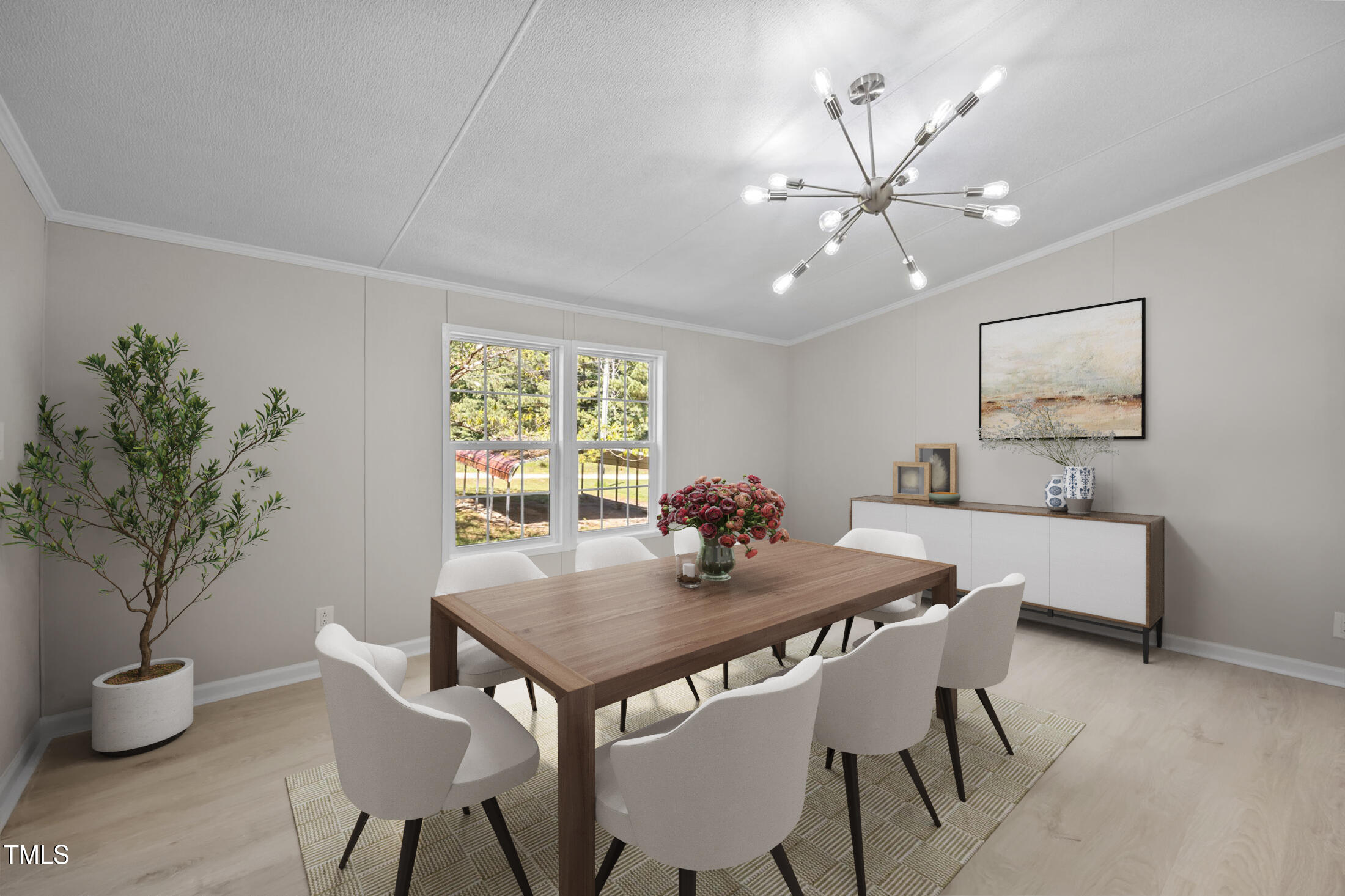 261 Ragland Lane Henderson, NC 27537 - Photo 6 of 58 a view of a dining room with furniture and a potted plant