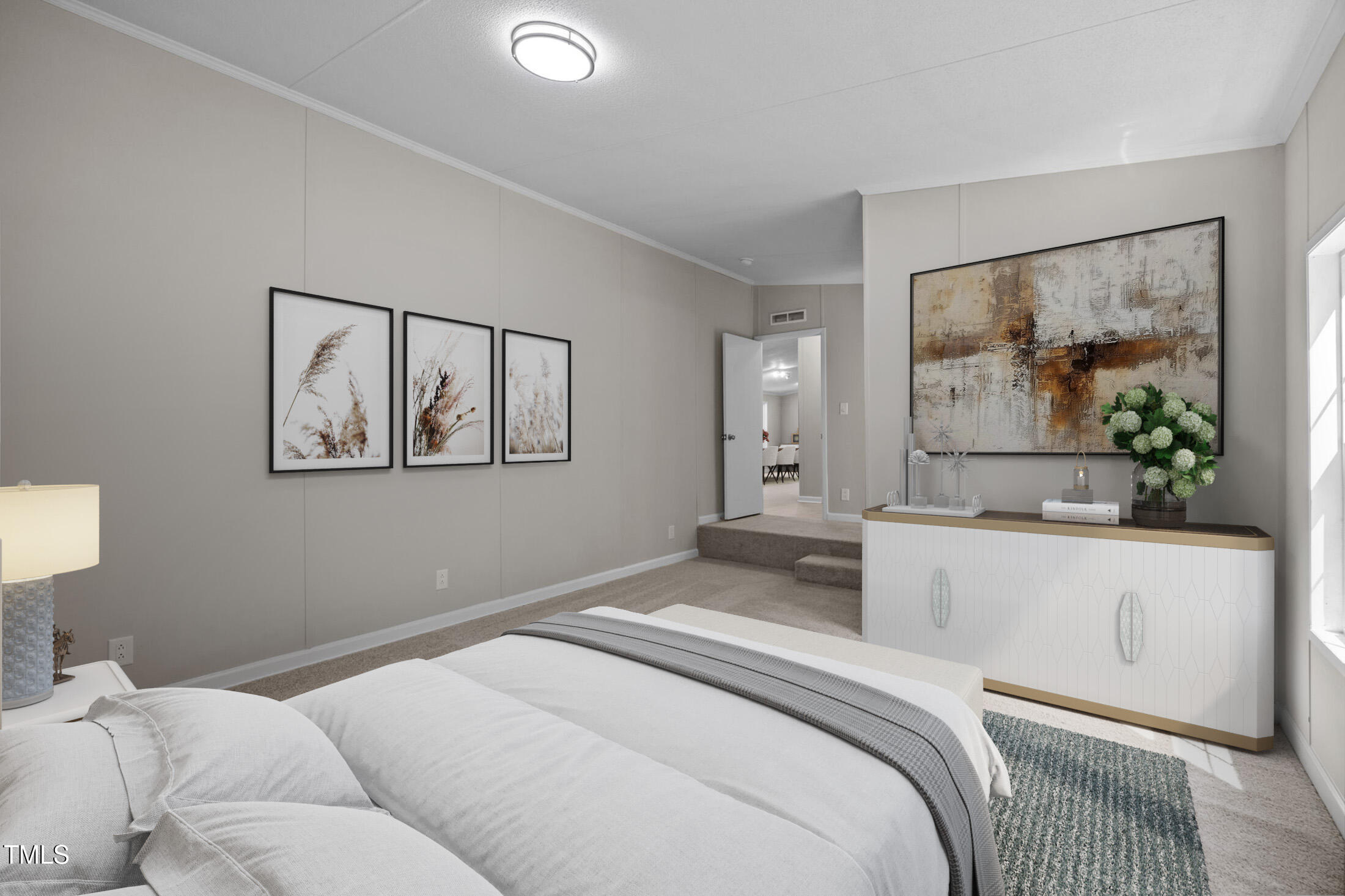 261 Ragland Lane Henderson, NC 27537 - Photo 7 of 58 a bedroom with a large bed and a painting on the wall