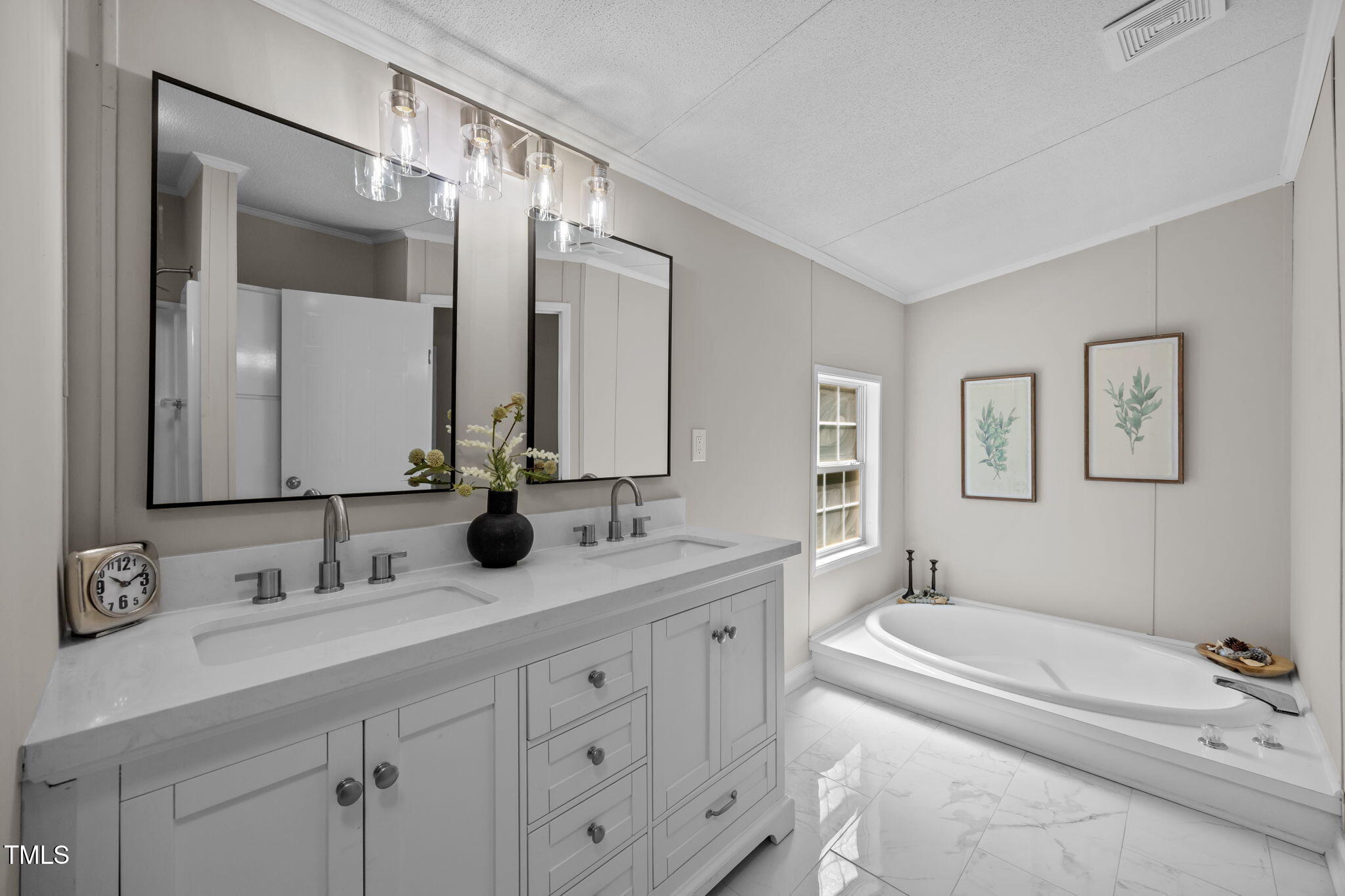 261 Ragland Lane Henderson, NC 27537 - Photo 8 of 58 a bathroom with a double vanity sink mirror double and bathtub