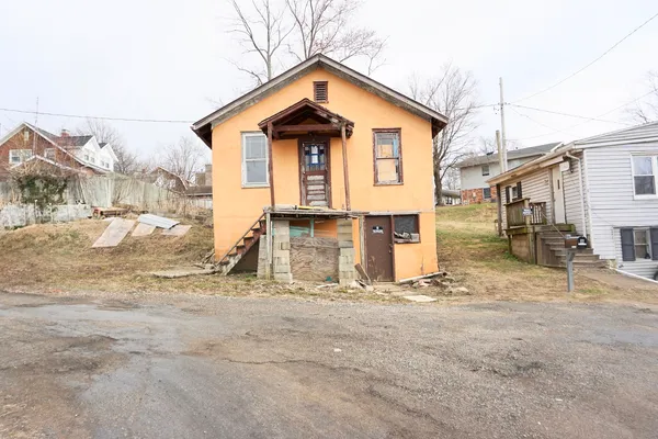 a view of a house with large windows