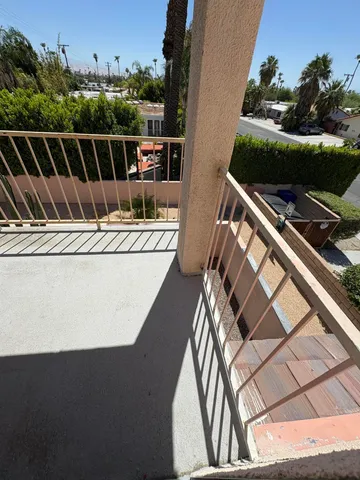 a view of balcony with furniture