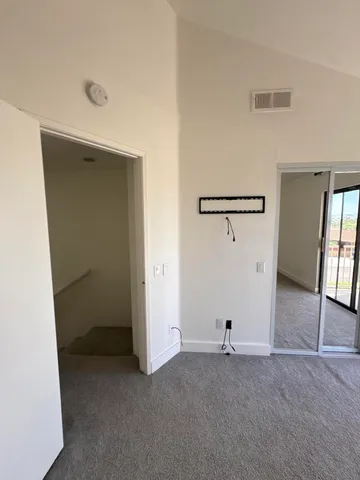 a view of a room with a hallway