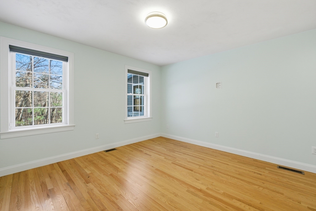 2 Turtle Lane, Unit 2 Sterling, MA 01564 - Photo 16 of 40 a view of empty room with wooden floor and fan