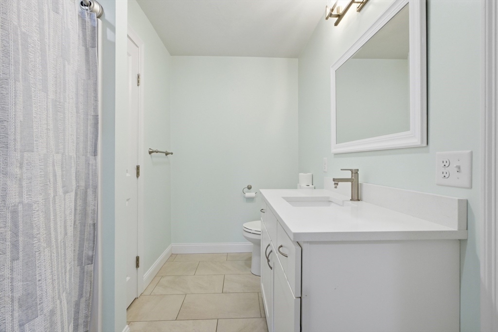 2 Turtle Lane, Unit 2 Sterling, MA 01564 - Photo 22 of 40 a bathroom with a sink and a mirror