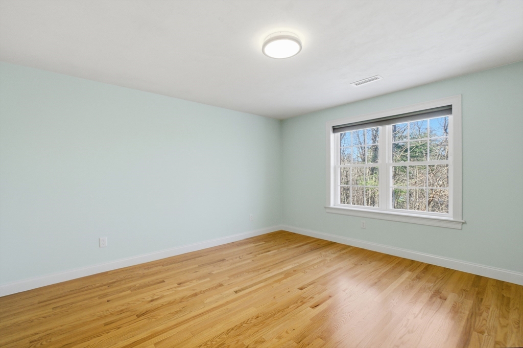 2 Turtle Lane, Unit 2 Sterling, MA 01564 - Photo 29 of 40 an empty room with wooden floor and windows