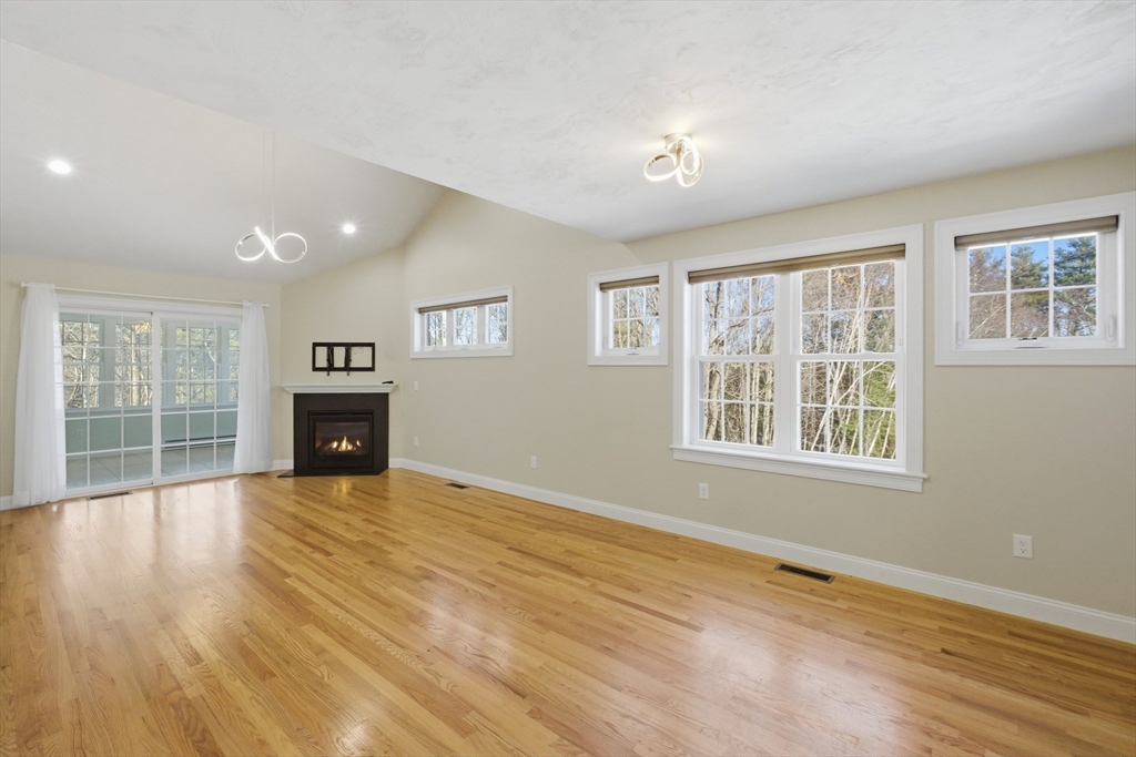 2 Turtle Lane, Unit 2 Sterling, MA 01564 - Photo 8 of 40 a view of an empty room with wooden floor and a window