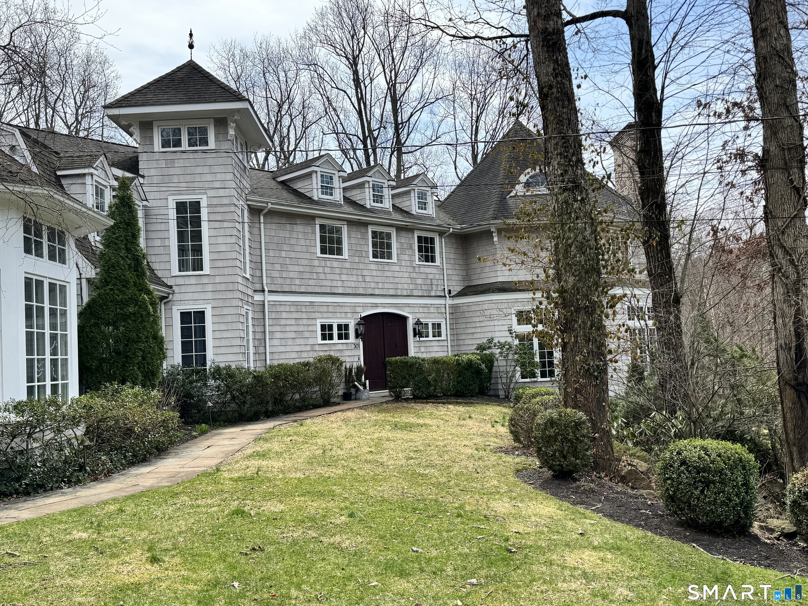 a front view of a house with garden