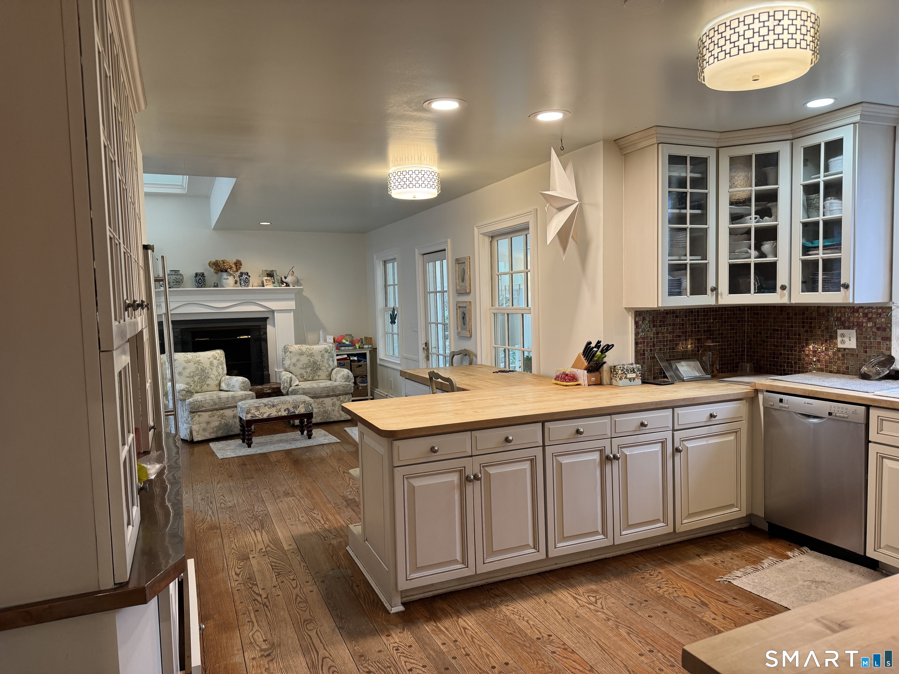301 Old Norwalk Road New Canaan, CT 06840 - Photo 11 of 27 a spacious bathroom with a granite countertop sink and a large mirror