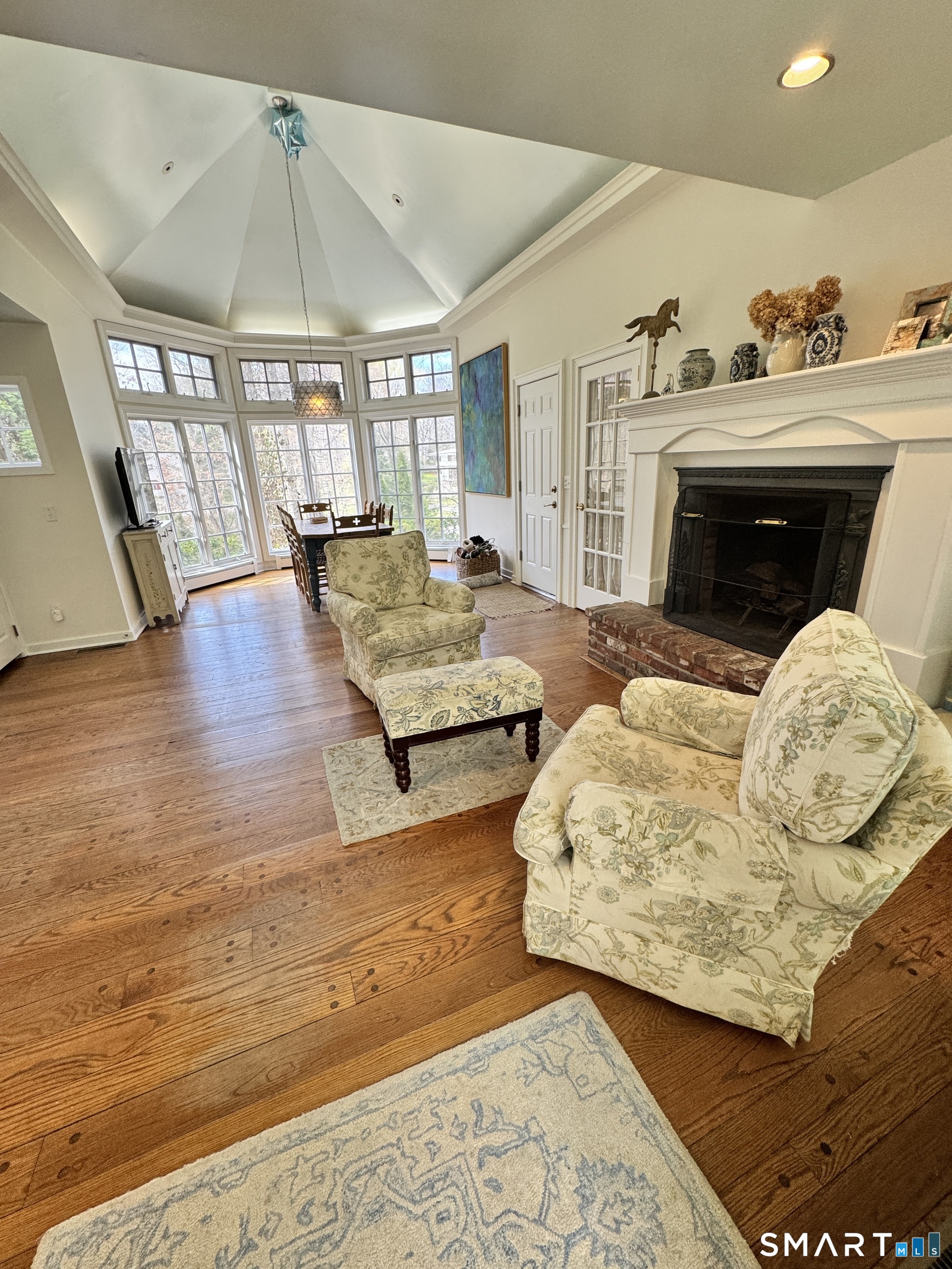 301 Old Norwalk Road New Canaan, CT 06840 - Photo 13 of 27 a living room with furniture and a fireplace