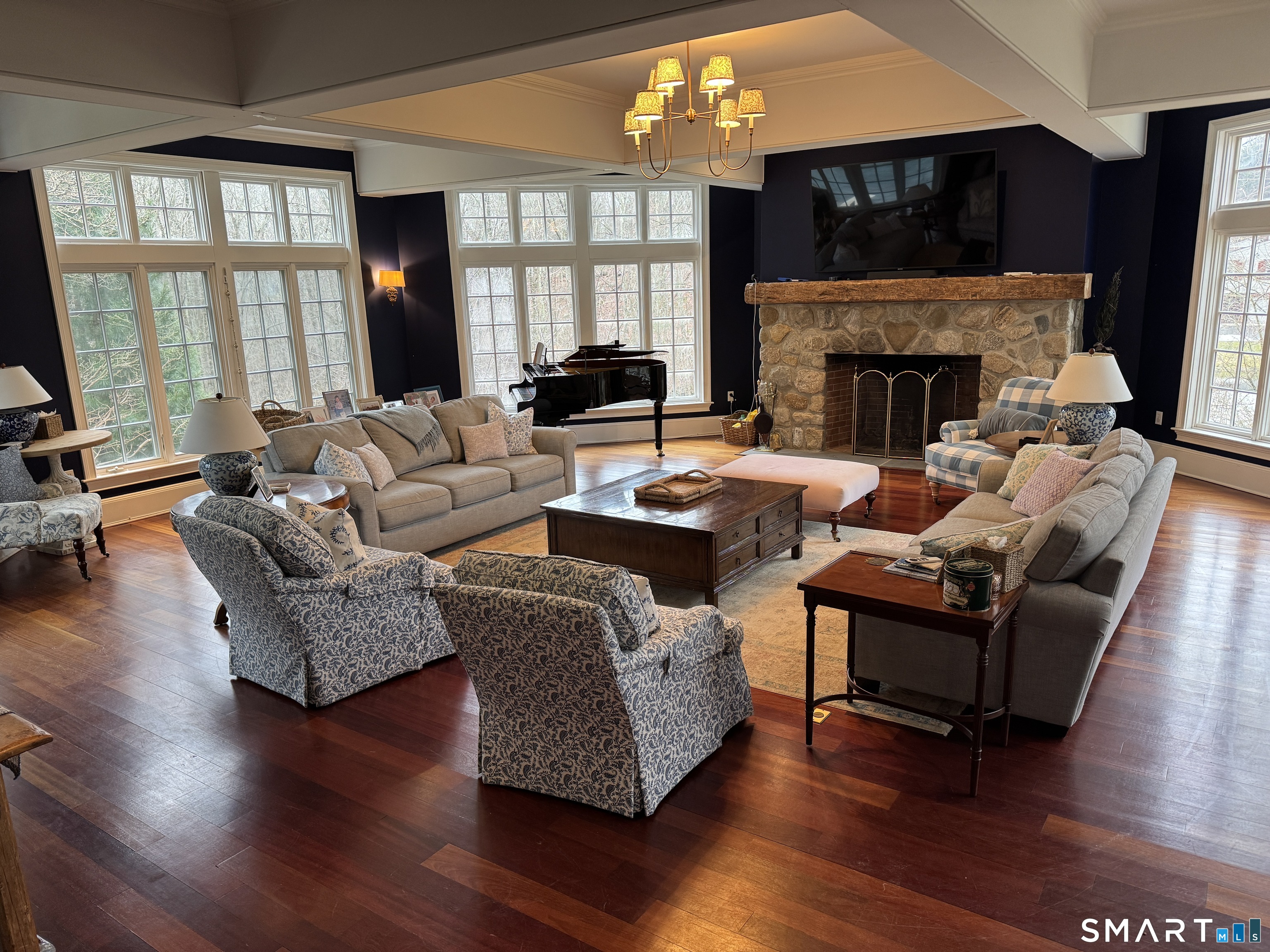 301 Old Norwalk Road New Canaan, CT 06840 - Photo 16 of 27 a living room with furniture large window and a fireplace