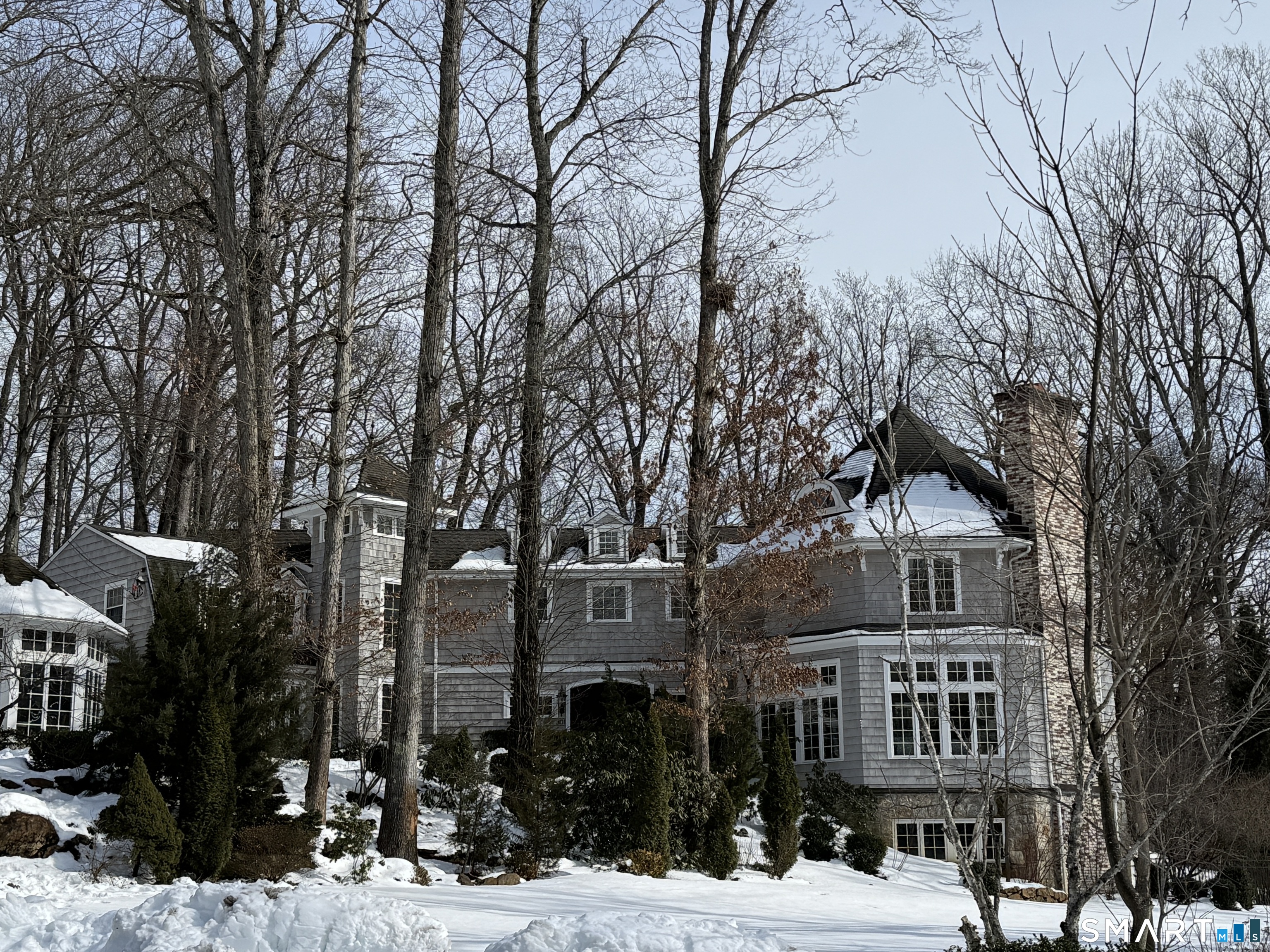 301 Old Norwalk Road New Canaan, CT 06840 - Photo 2 of 27 a front view of a building with trees