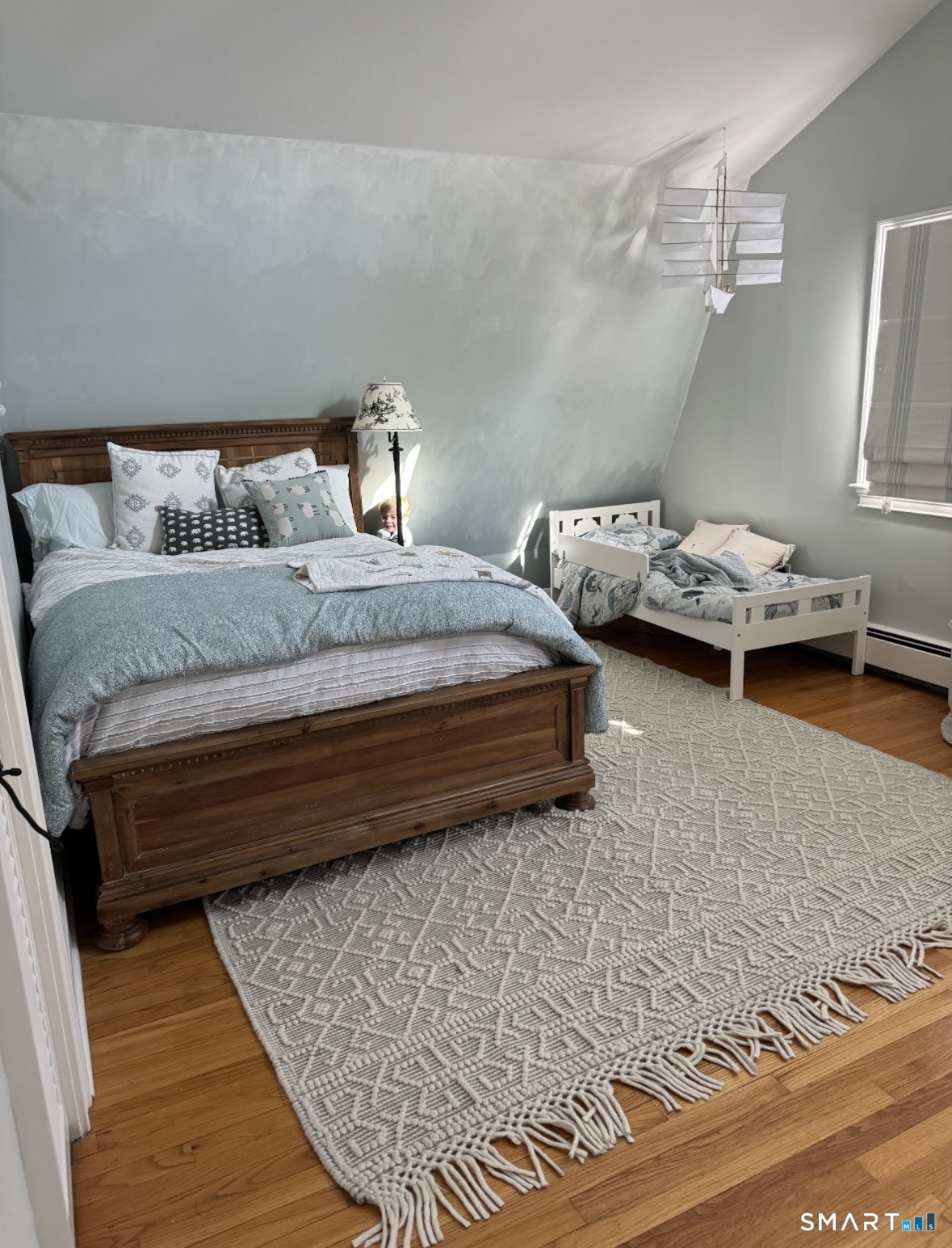 301 Old Norwalk Road New Canaan, CT 06840 - Photo 21 of 27 a bedroom with a bed and cabinets