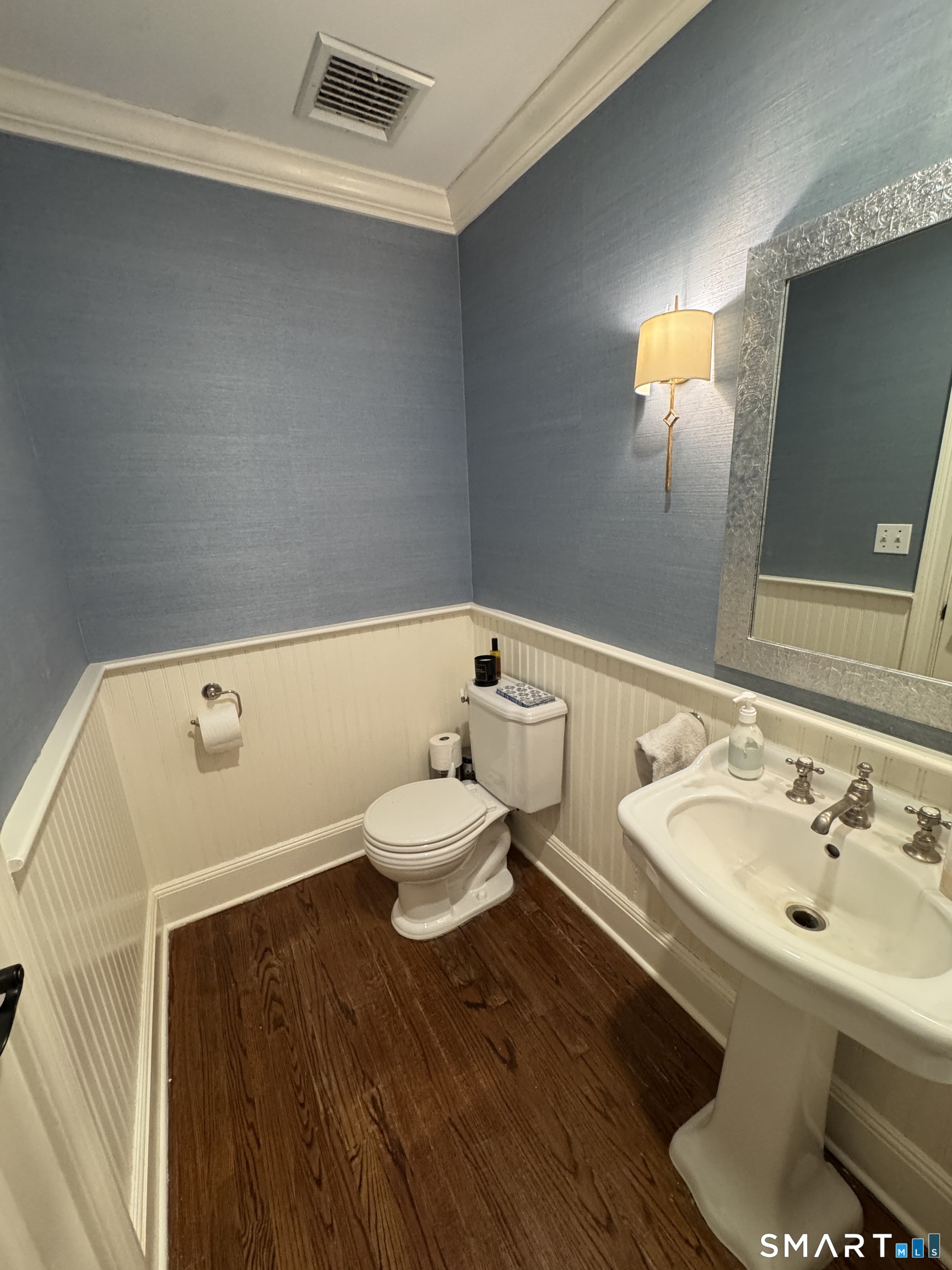 301 Old Norwalk Road New Canaan, CT 06840 - Photo 24 of 27 a bathroom with a sink and a mirror