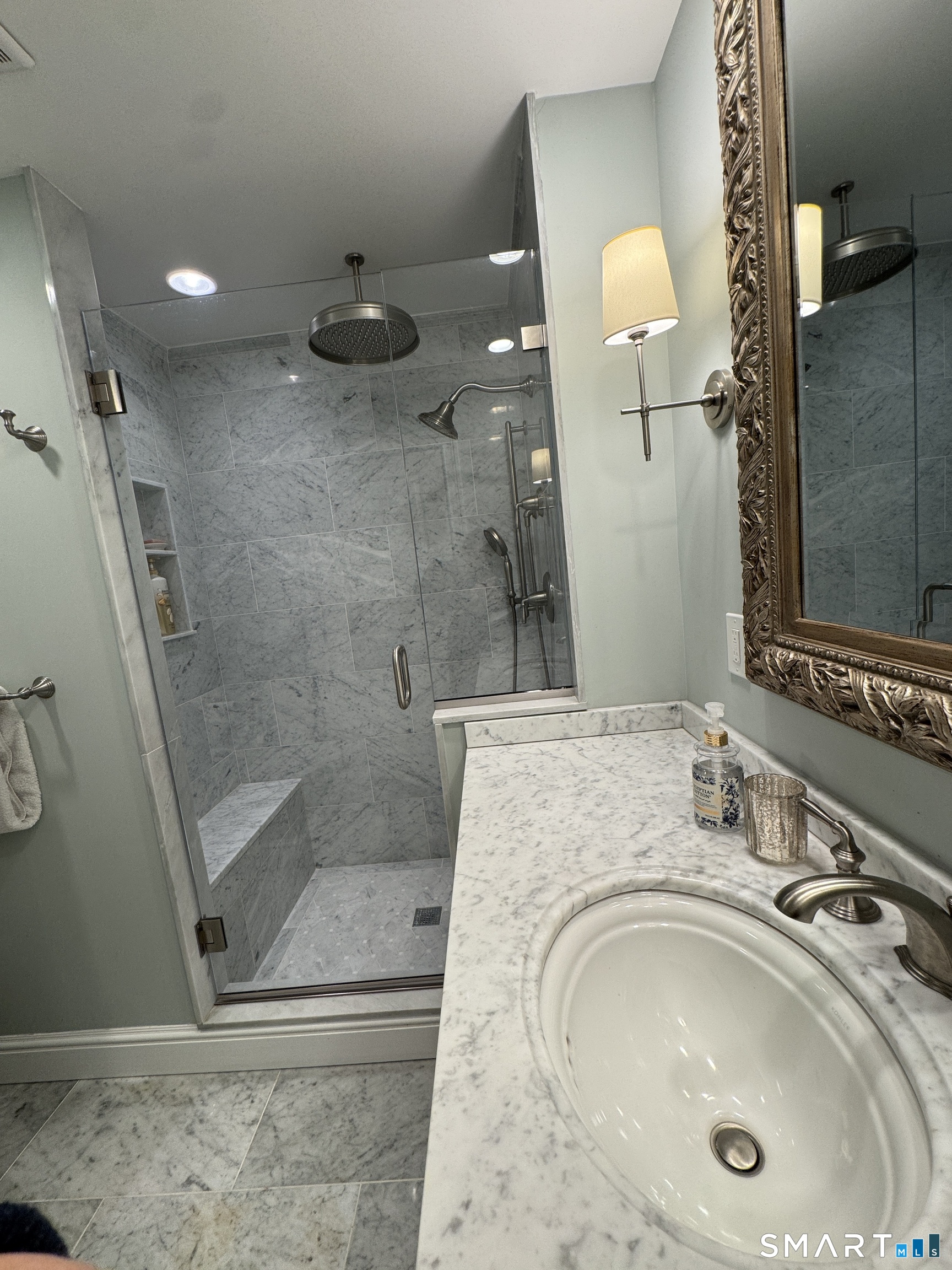 301 Old Norwalk Road New Canaan, CT 06840 - Photo 25 of 27 a bathroom with a sink a toilet and shower