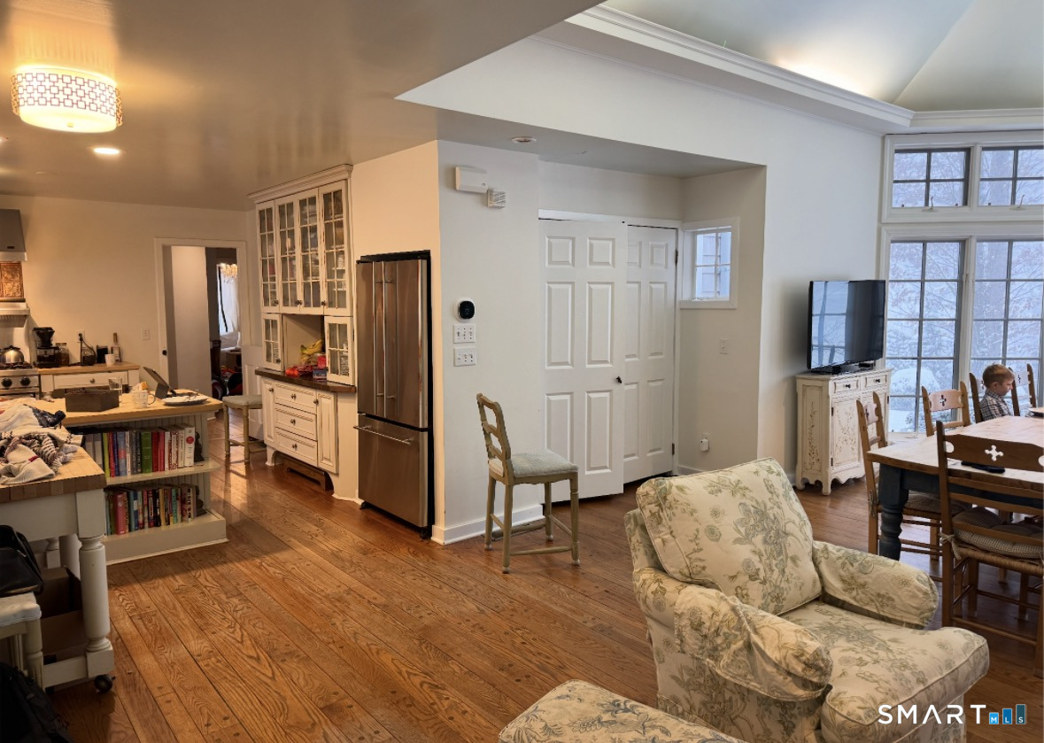 301 Old Norwalk Road New Canaan, CT 06840 - Photo 8 of 27 a bedroom with furniture and a flat screen tv