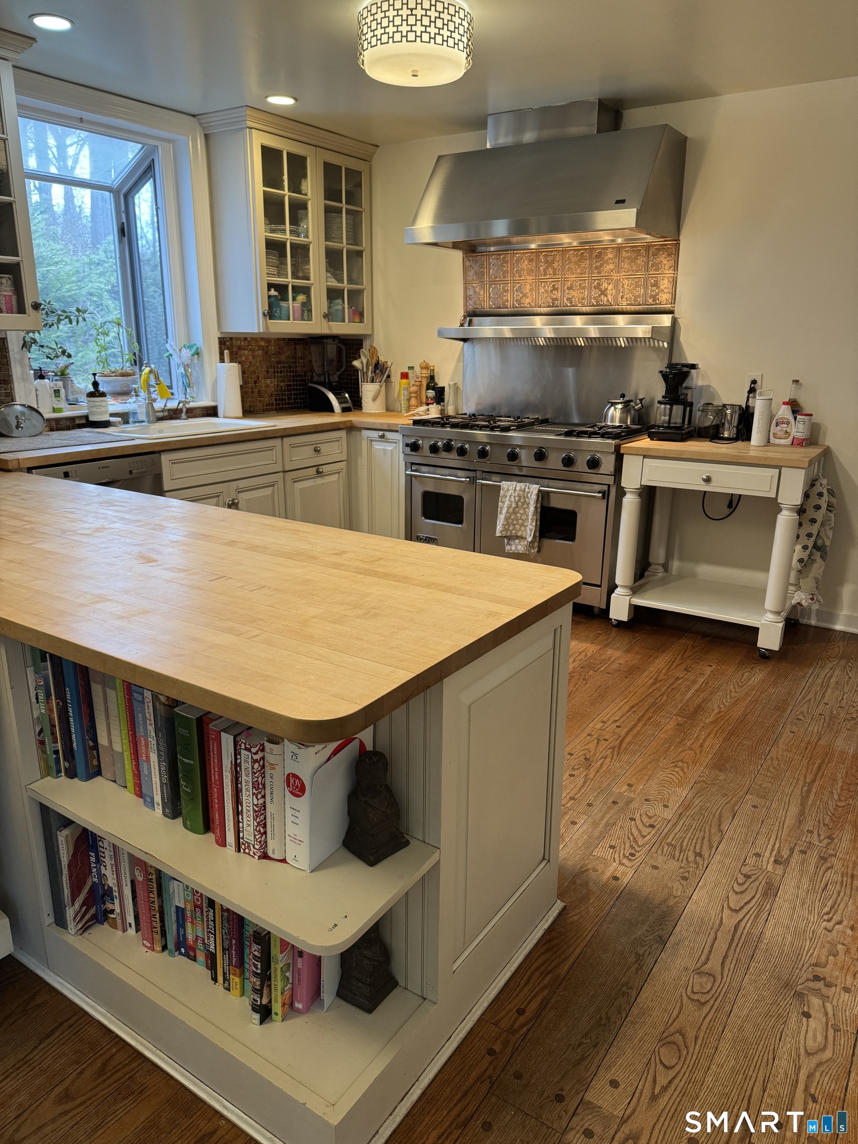 301 Old Norwalk Road New Canaan, CT 06840 - Photo 9 of 27 a kitchen with stainless steel appliances granite countertop a stove and a refrigerator