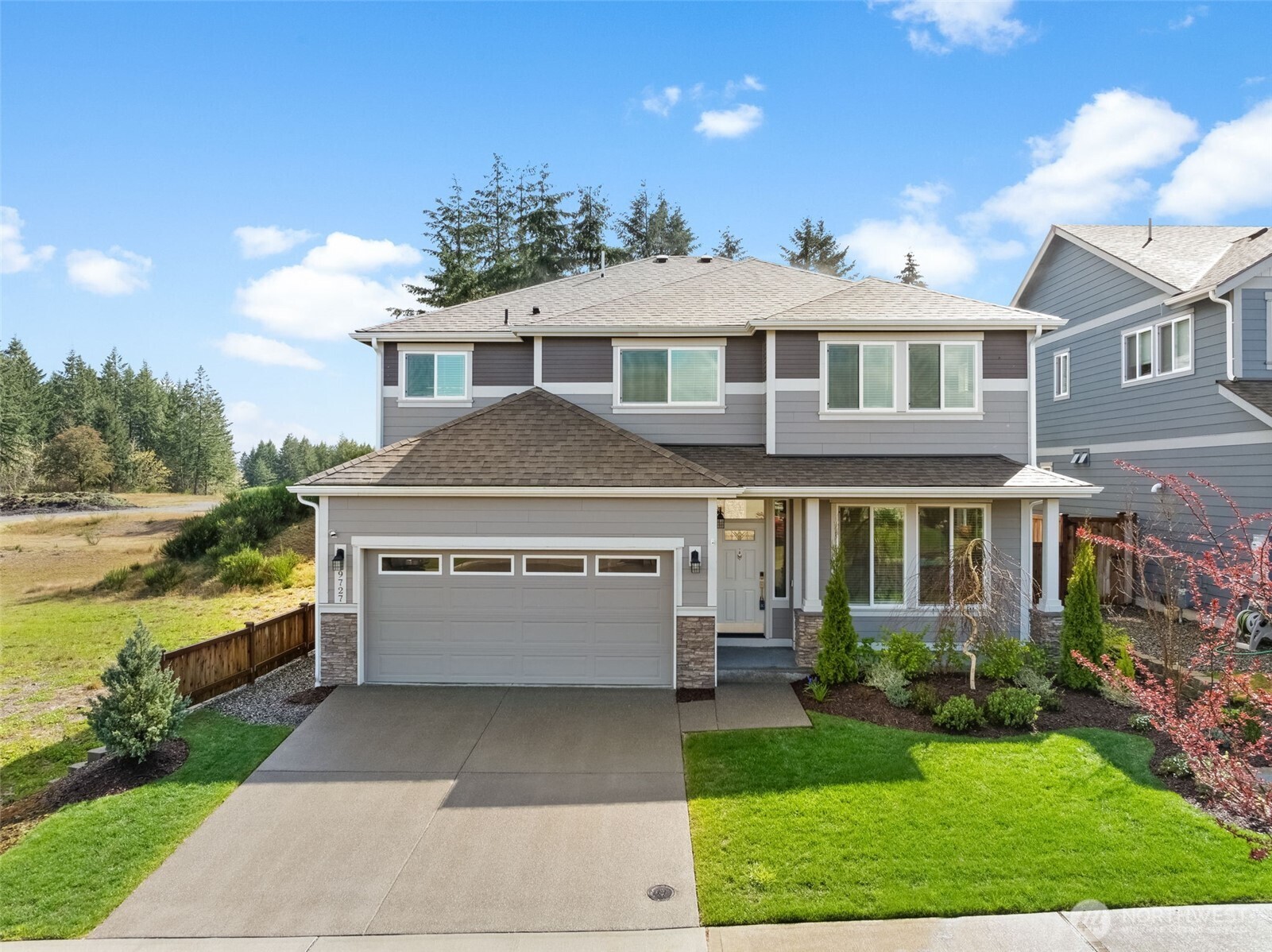 a front view of a house with a yard
