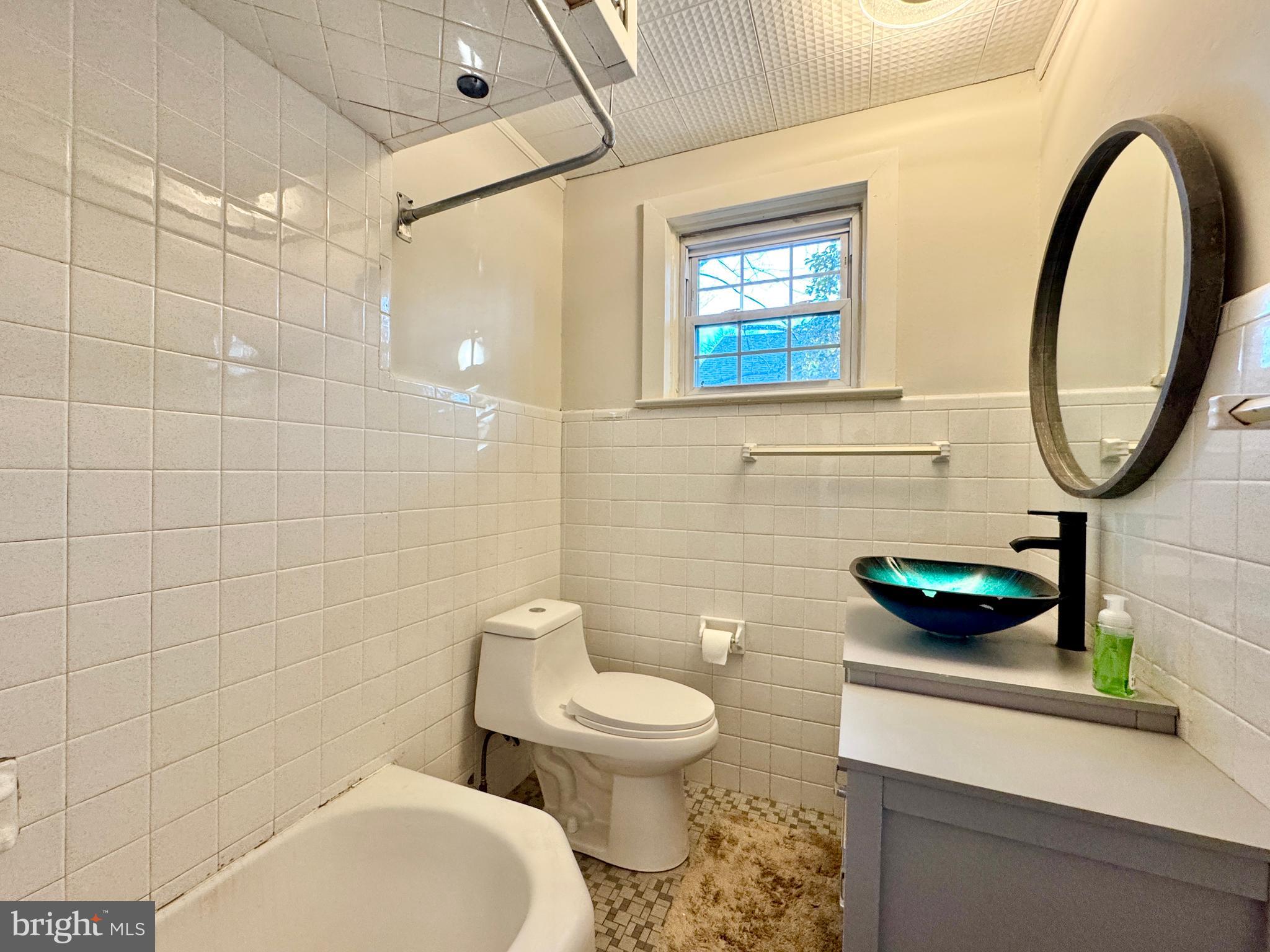 301 Linderman Avenue Cherry Hill, NJ 08002 - Photo 15 of 23 a bathroom with a toilet a sink and a mirror