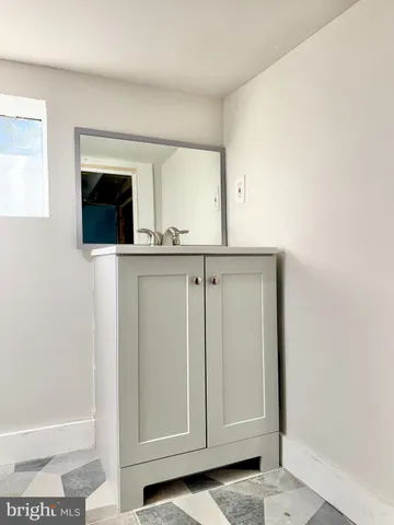 a view of a kitchen with cabinets