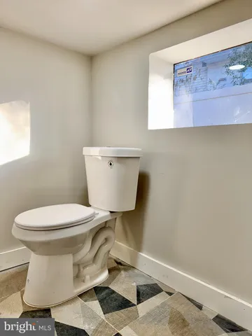 a bathroom with a toilet and a sink