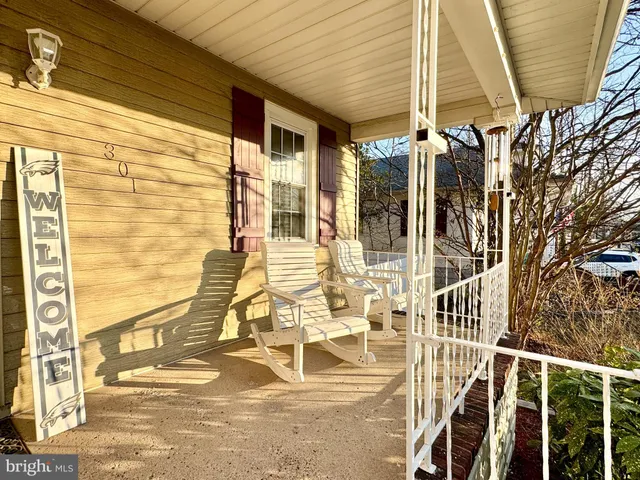 a view of a balcony with dining area