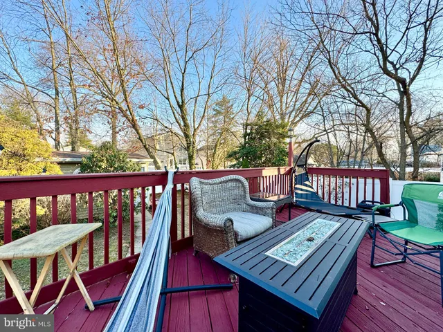 a view of a wooden deck with furniture
