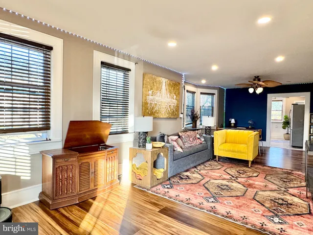a living room with furniture and a rug