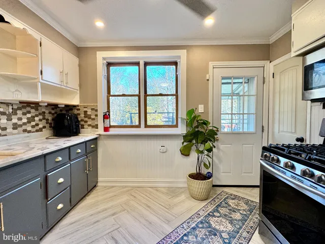 a kitchen with a stove and a sink