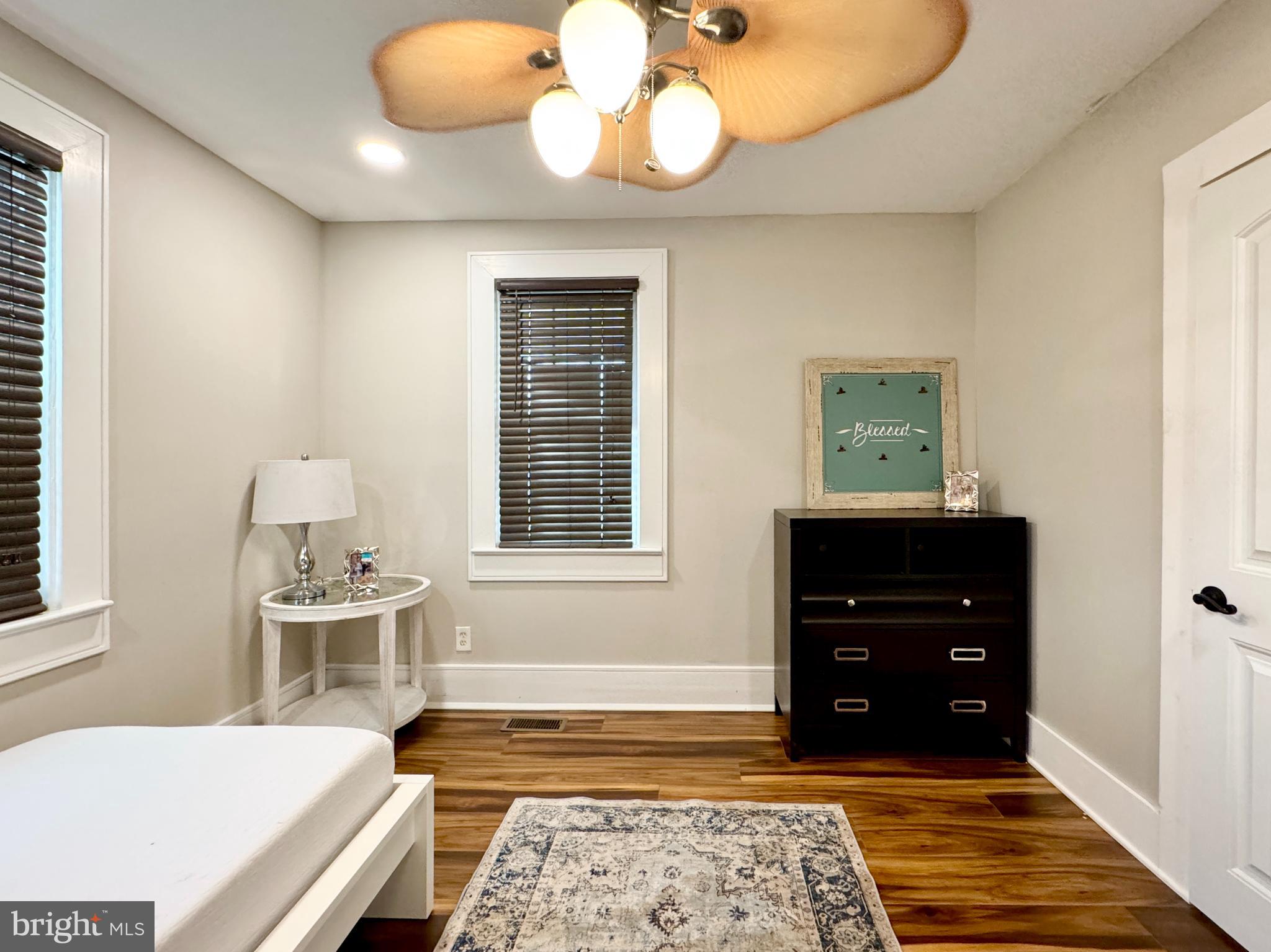 301 Linderman Avenue Cherry Hill, NJ 08002 - Photo 10 of 23 a bedroom with a bed and wooden floor