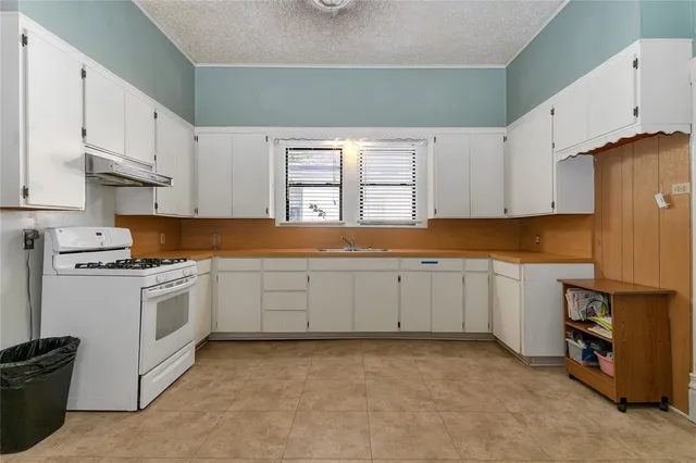 a kitchen with a cabinets and a stove