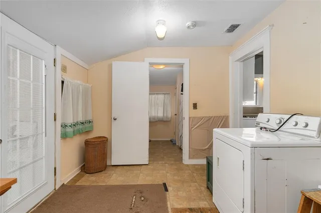 a view of a house with wooden deck