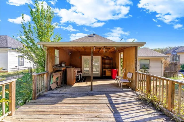 a view of house with yard and sitting area