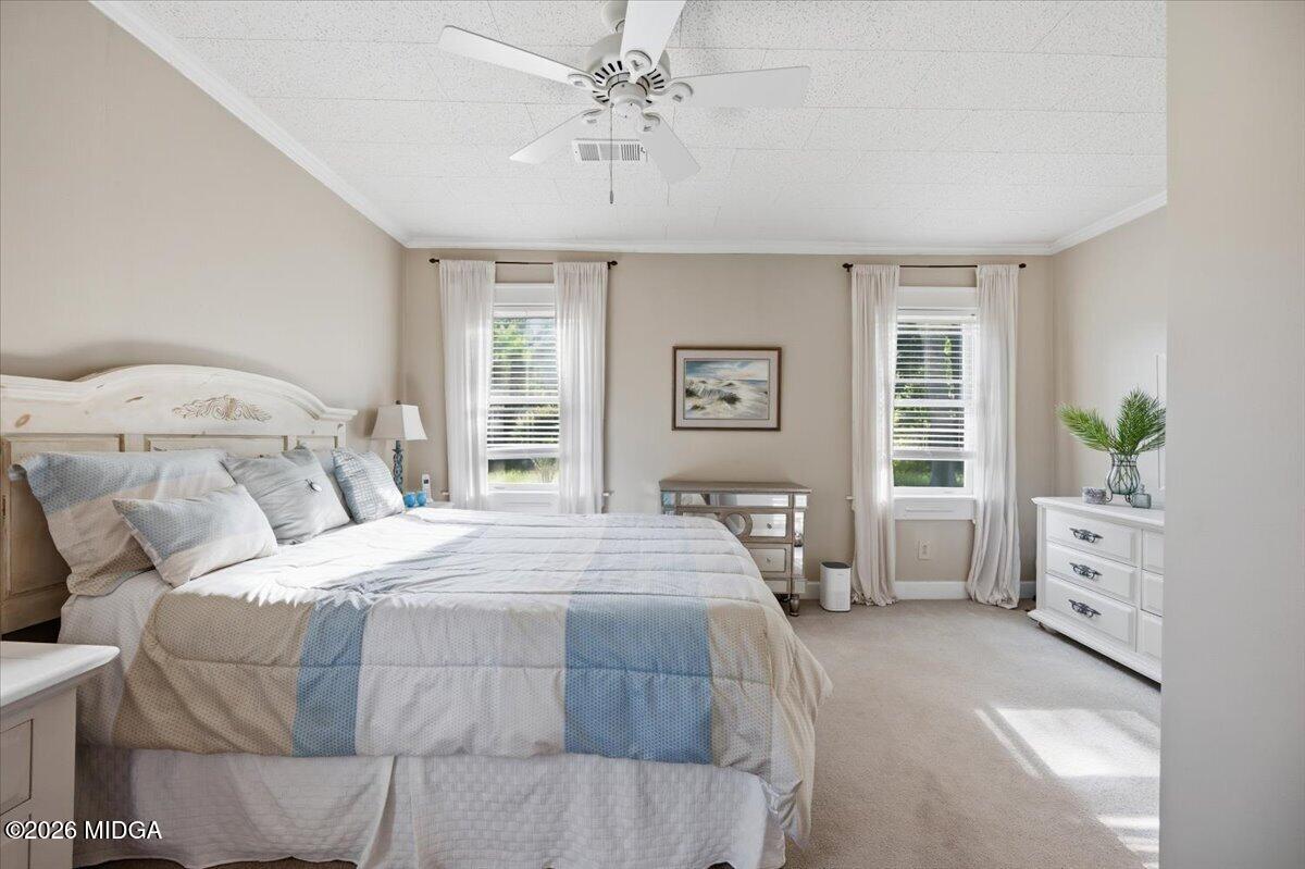 214 Howard Roberts Road Gray, GA 31032 - Photo 16 of 36 a bedroom with a large bed and a window