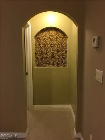 a view of empty room with a window