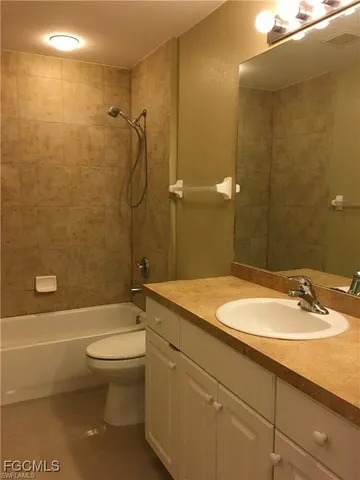 a view of house with backyard