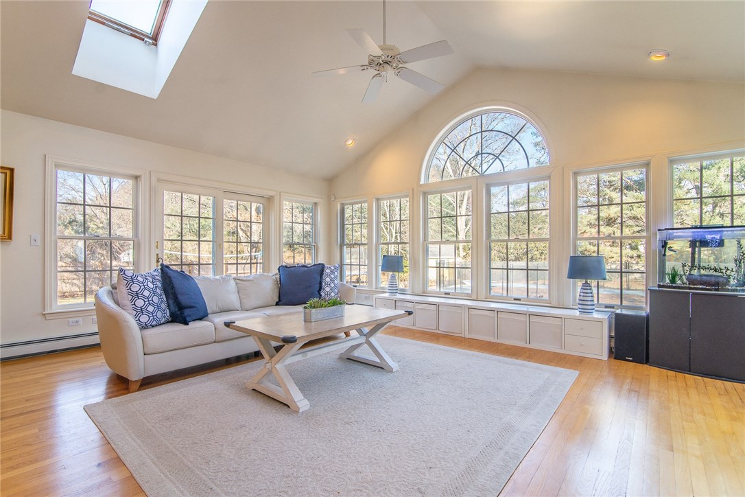21 Heritage Road Barrington, RI 02806 - Photo 2 of 33 400 sq foot all season sun room leading to back yard via 2 sets of french doors