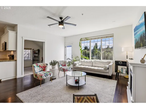 a living room with furniture and a large window