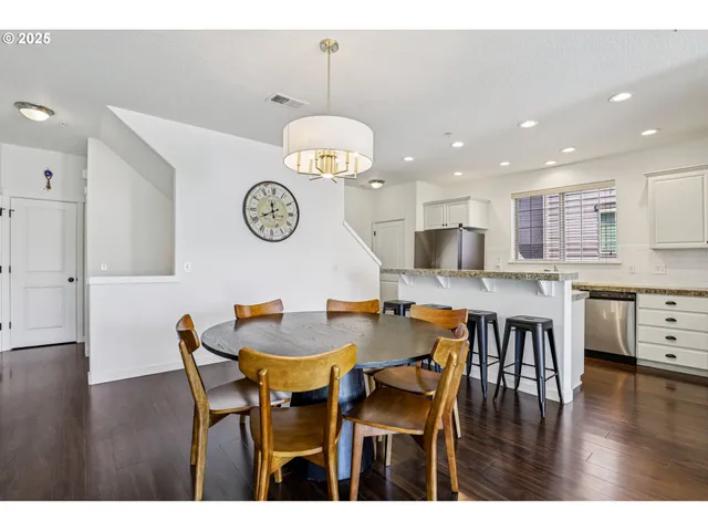 a view of a dining area with furniture and wooden floor