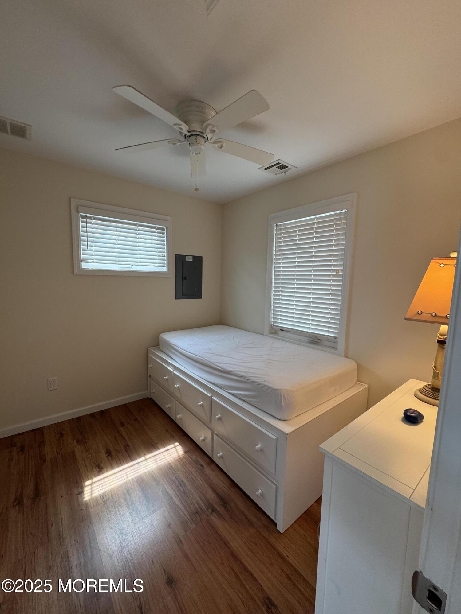 29 East Dune Way Lavallette, NJ 08735 - Photo 9 of 9 a bedroom with a bed and a night stand