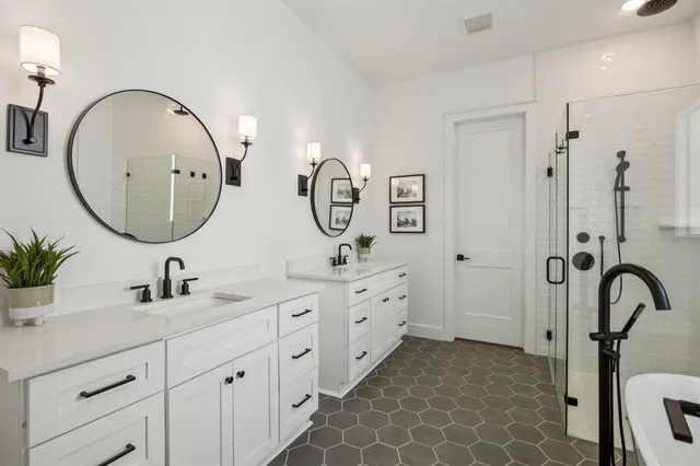 a bathroom with a double vanity sink double mirror and a mirror
