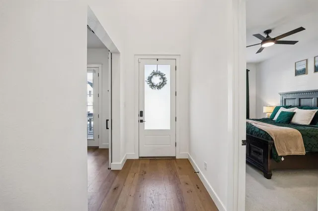 a view of bedroom with furniture and wooden floor