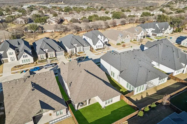 an aerial view of a house with a ocean view