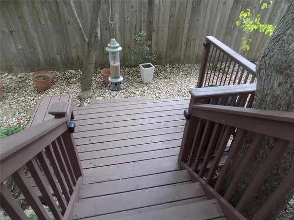 a view of balcony with wooden floor