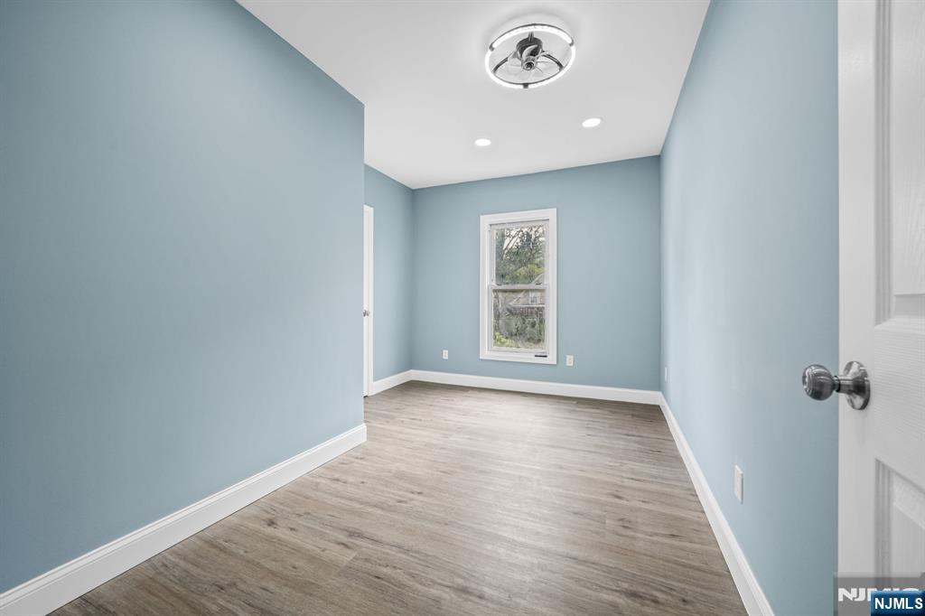 137 Prospect Place Rutherford, NJ 07070 - Photo 11 of 19 an empty room with wooden floor and windows