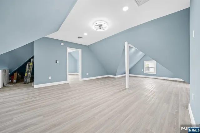 a view of a livingroom with wooden floor